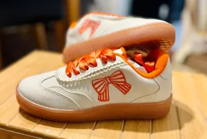 Orange bow sneakers