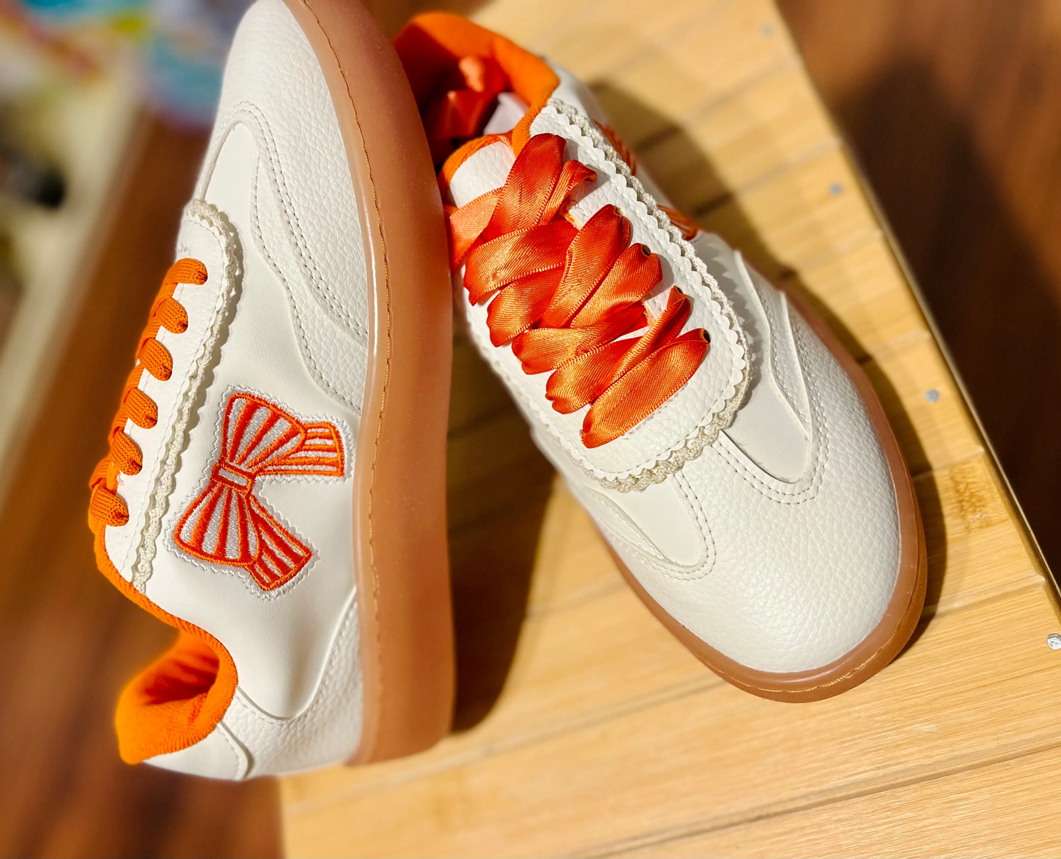 Orange bow sneakers