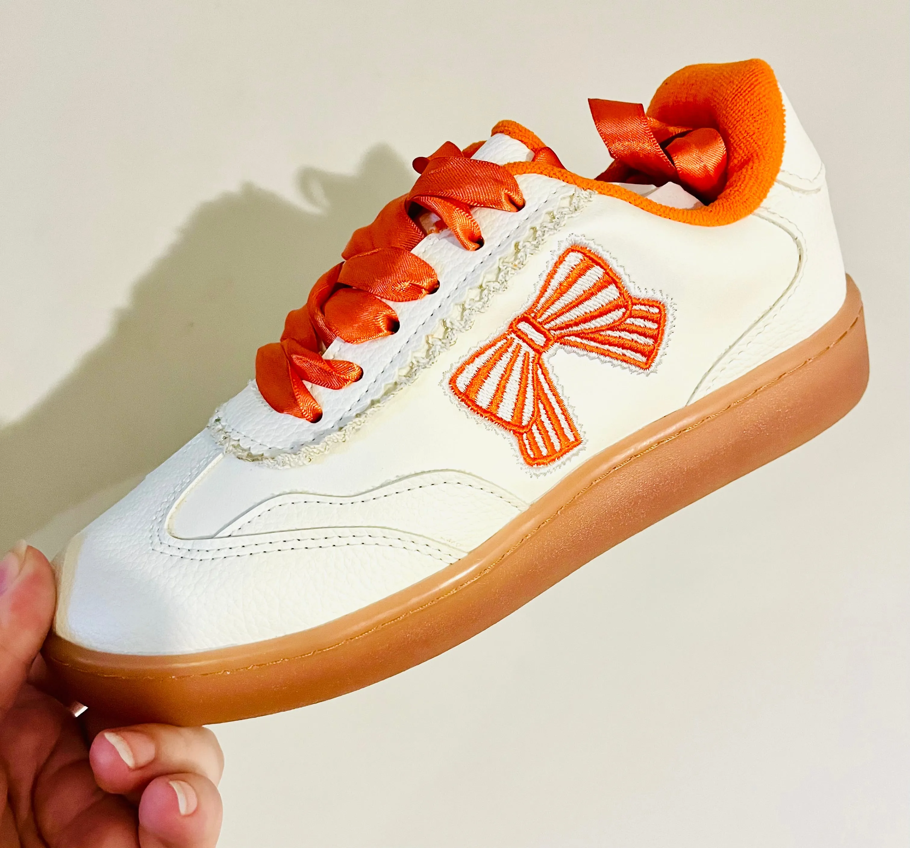 Orange bow sneakers